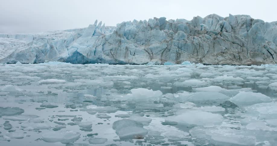 The water is filled with ice leading up to an ice wall