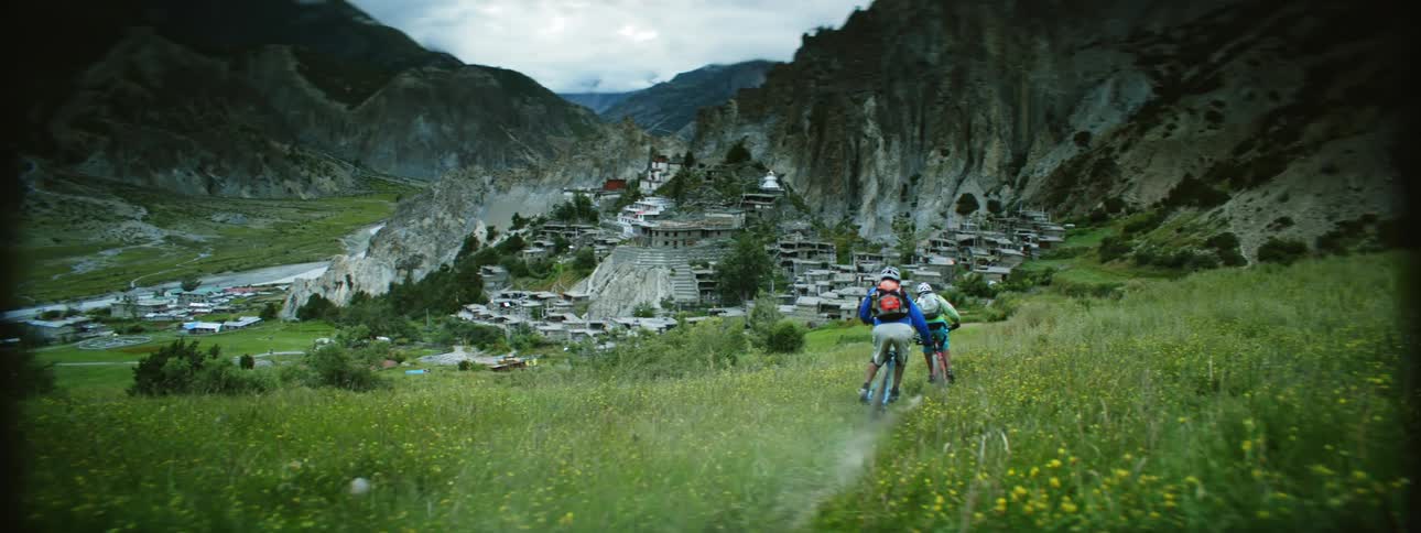 Cross Country Cycling through Grassy Fields and Ruins in Nepal