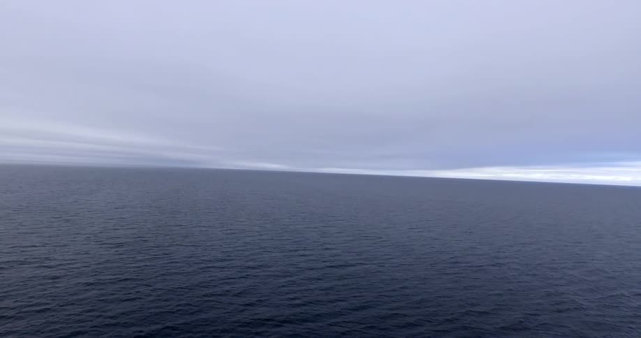 A wide expanse of ocean on a cloudy day