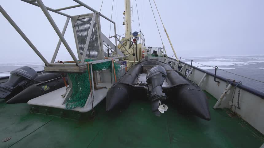 A raft is on a large boat in the water