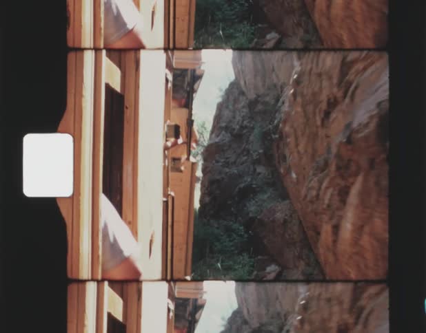 A train drives visitors through a canyon
