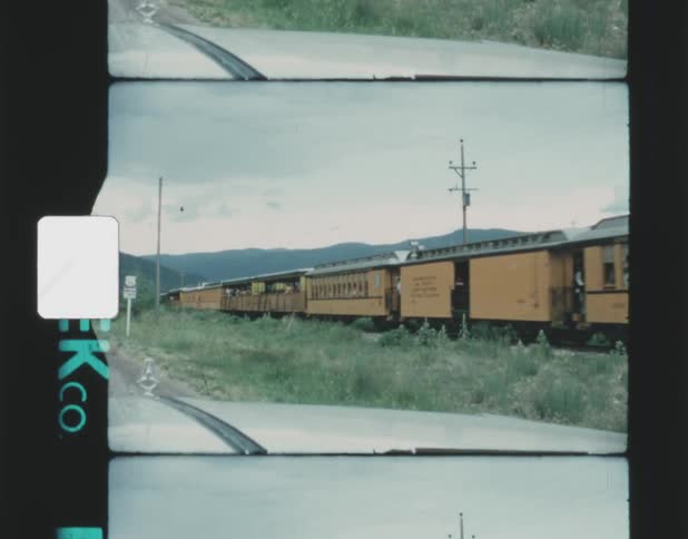 Vintage footage of passenger train coming from mountains