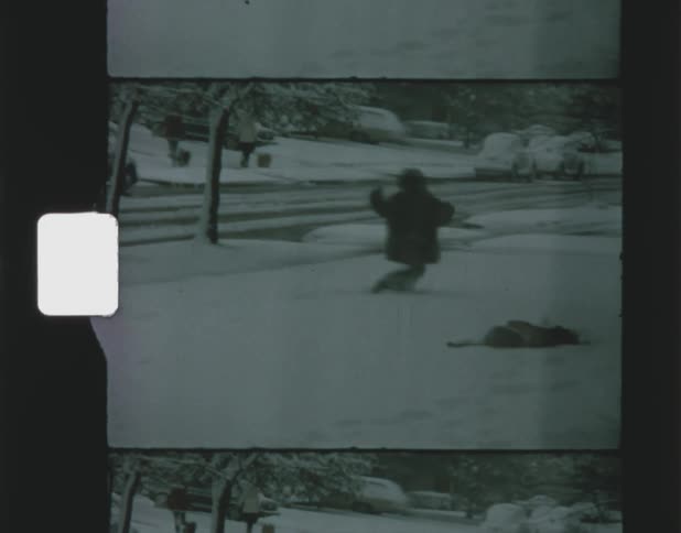 Two children playing in the snow