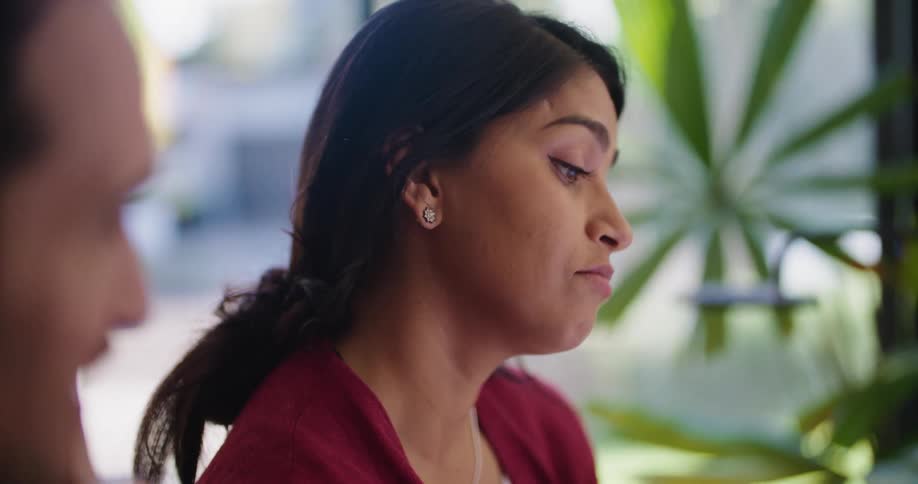 Coworkers talk in the office