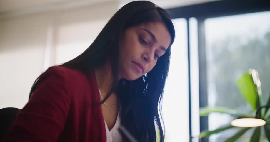 A woman works at her desk in the office