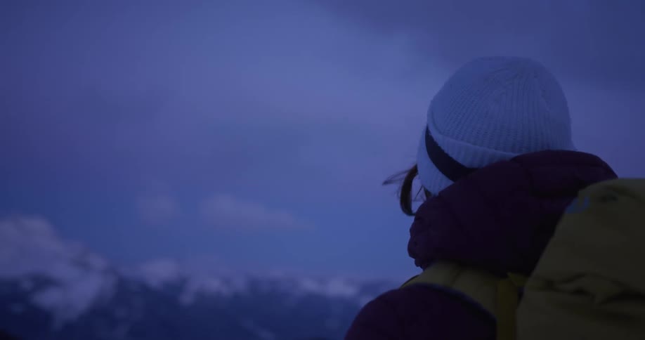 A person takes in the view while backpacking