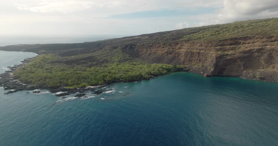 The water is blue around the island