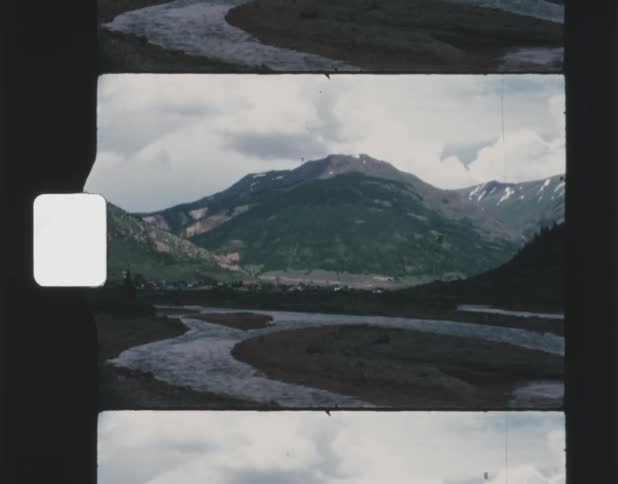 A landscape view of mountains on a cloudy day