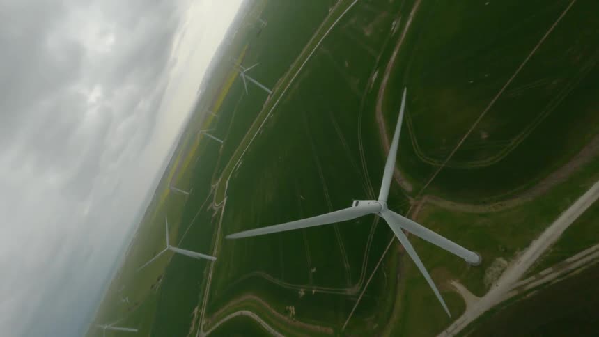 A view of windmills out in a field
