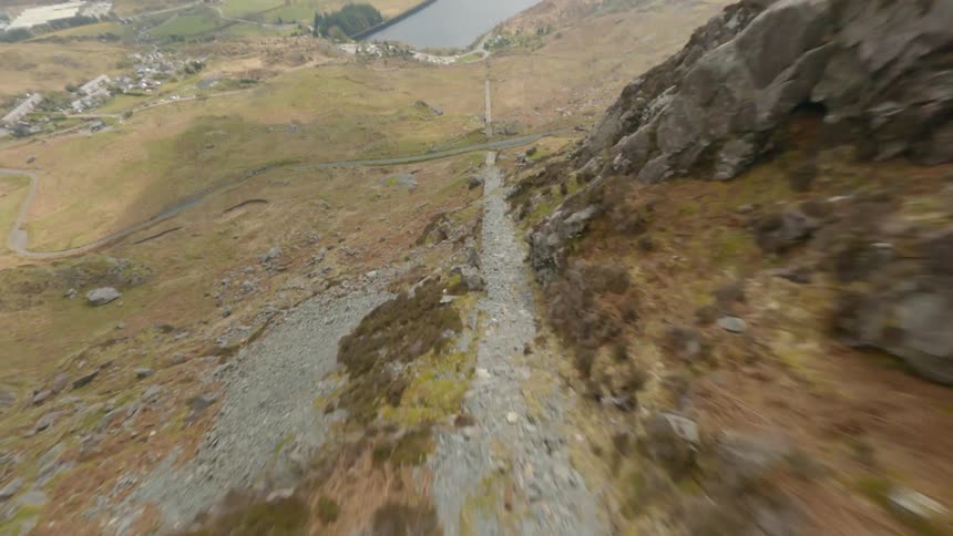 A river is at the bottom of the mountain
