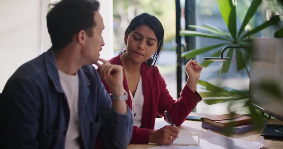 Man and woman are talking together in their office