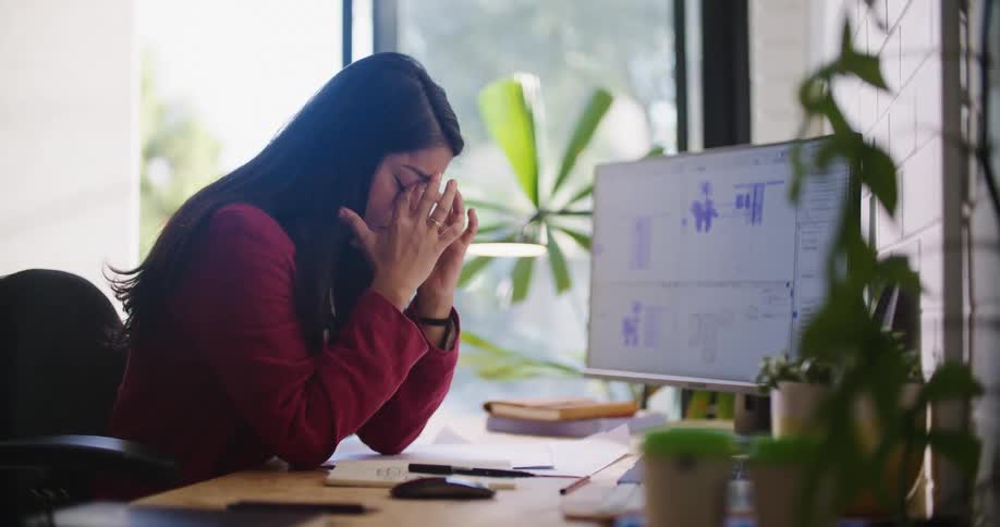 A woman working in an office on a computer