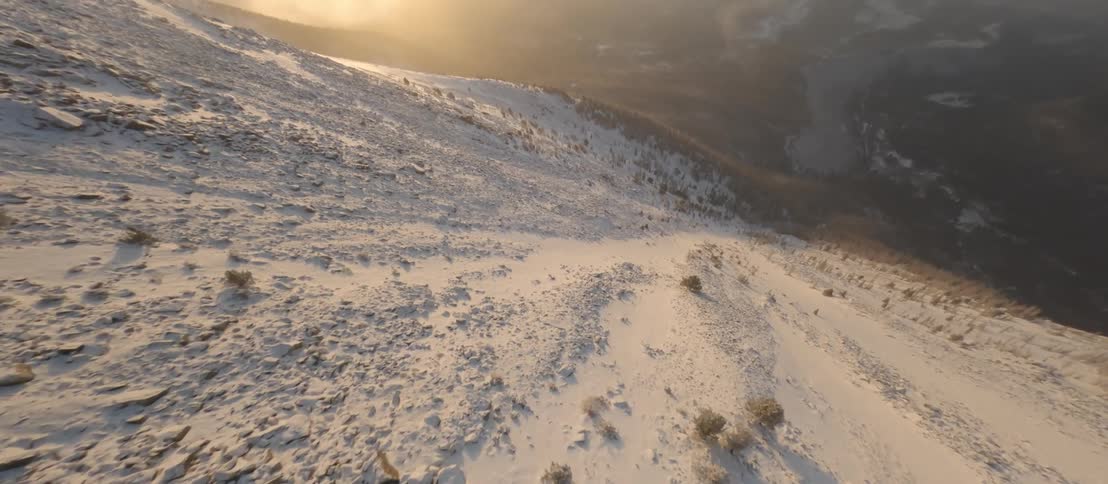 Aerial view of the mountainside is displayed in winter