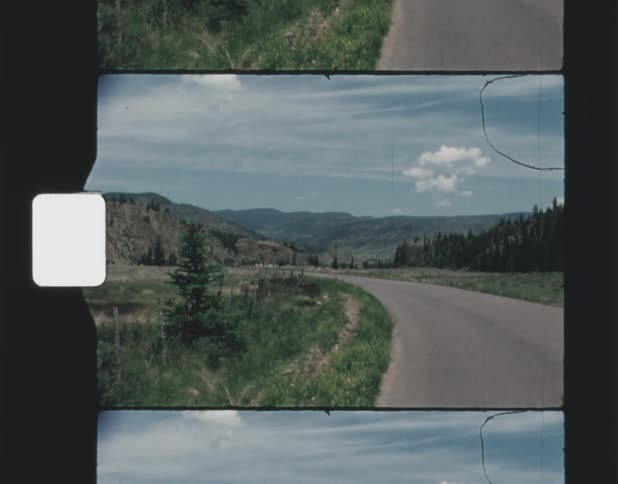 A road runs towards the mountains