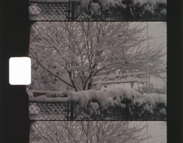 Film footage of a neighborhood during winter season