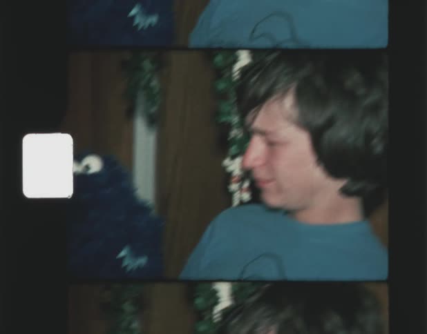 A teenager is playing with a hand puppet