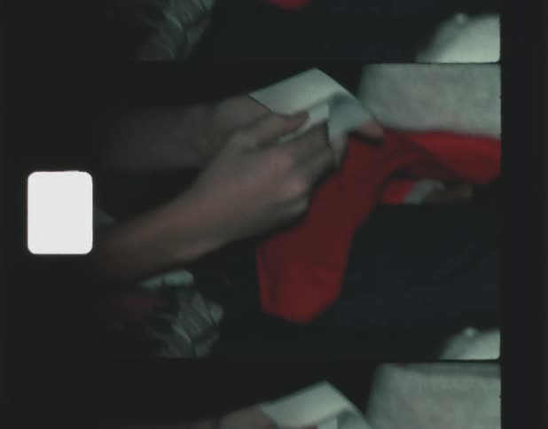 Teenage boy with t shirt laughs next to dalmatian sitting on couch