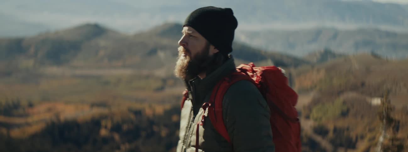 A man hiking up a hill