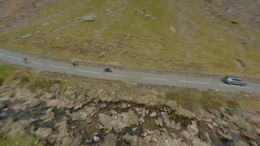 Aerial view of valley highways between barren mountains