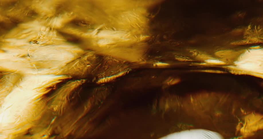 Close up of choppy golden liquid