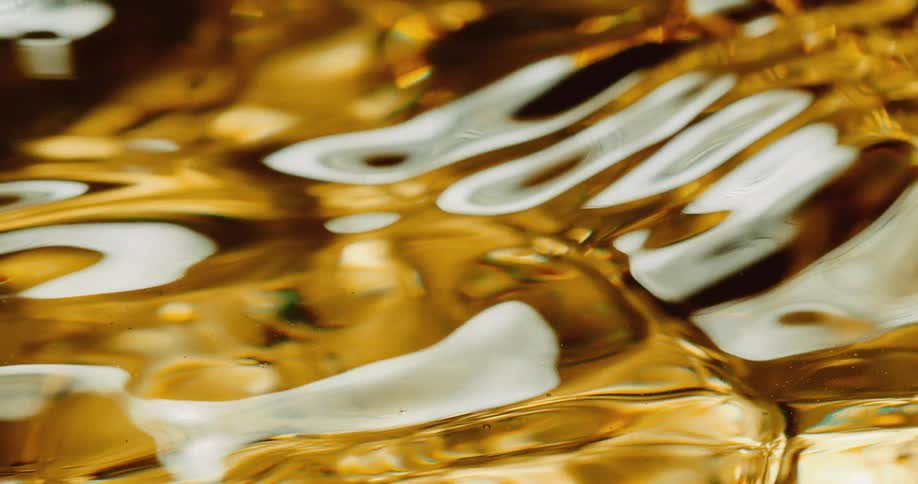 Close up of abstract golden liquid