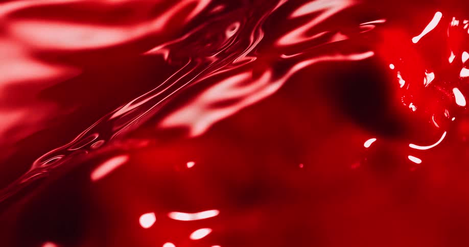 The red liquid moves and bubbles