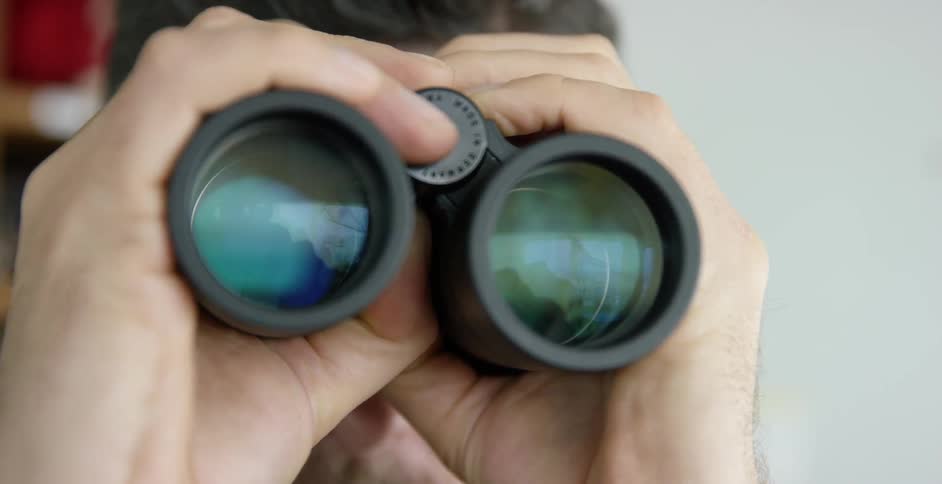A person is using binoculars