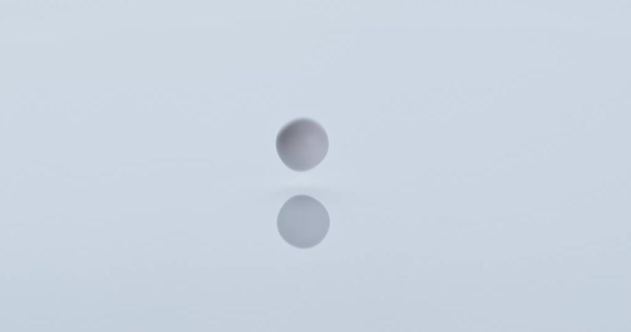 A water drop falling into water