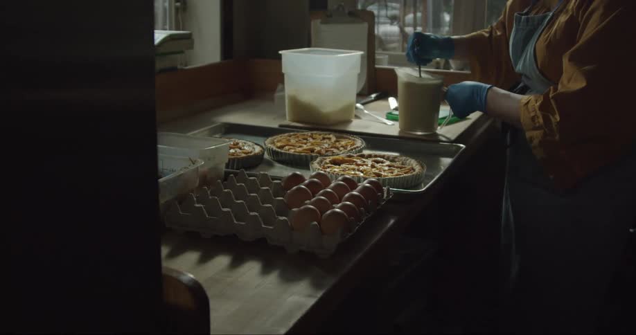 A woman is mixing ingredients in the restaurant