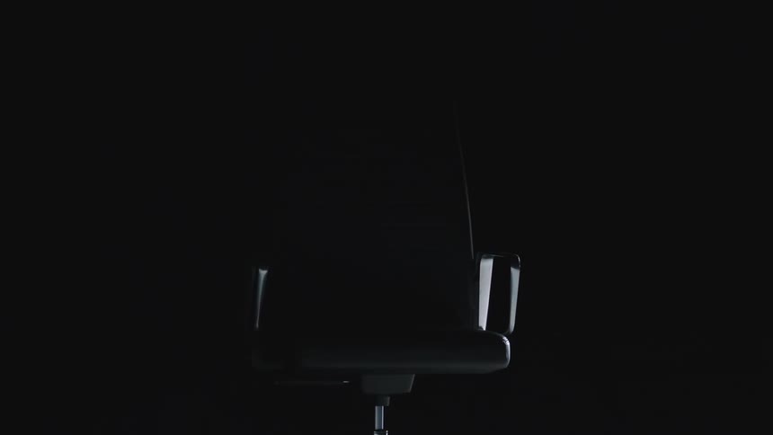 The chair spins in the dark