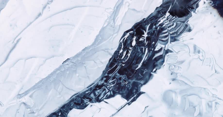 A close up of a block of ice breaking down the middle