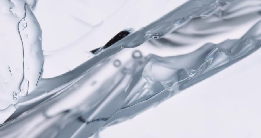 An abstract piece of textured art breaking and creating water droplets
