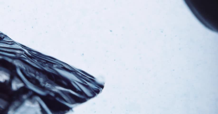 Ridges and lines form in a clear solid object