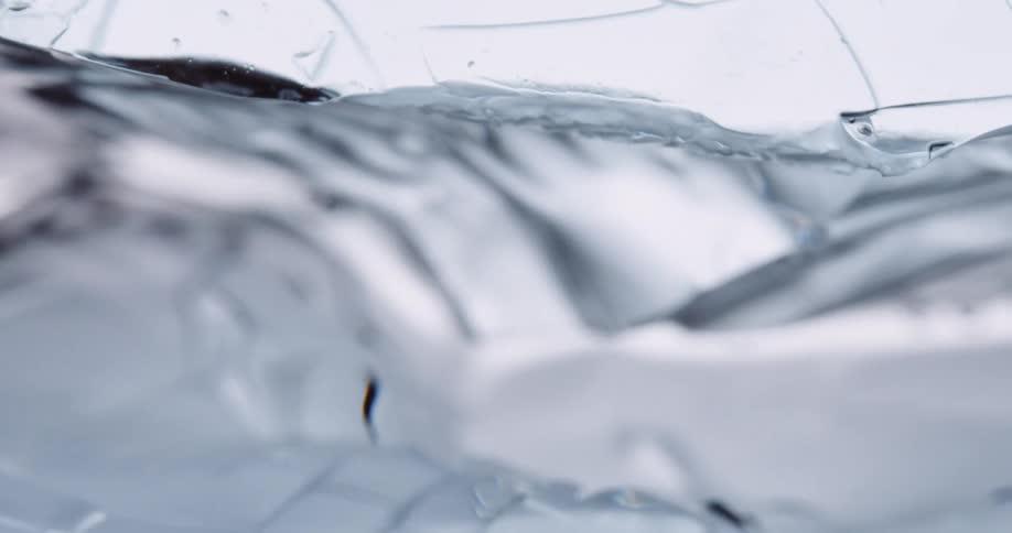 Water melts and cracks a section of ice
