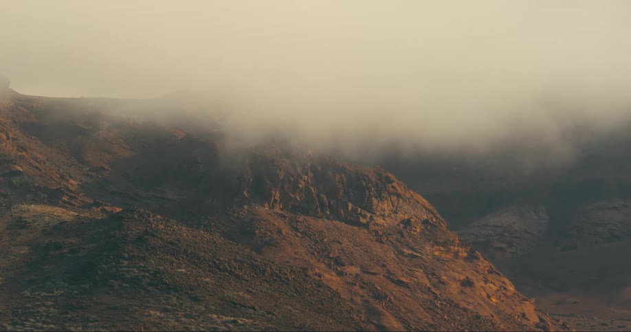A cloudy view of a solitary hill in the land