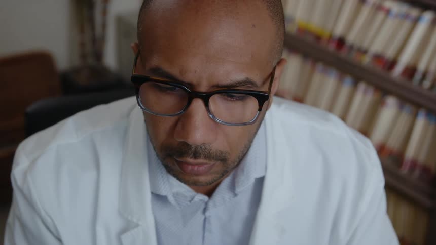 An employee is sitting in his office