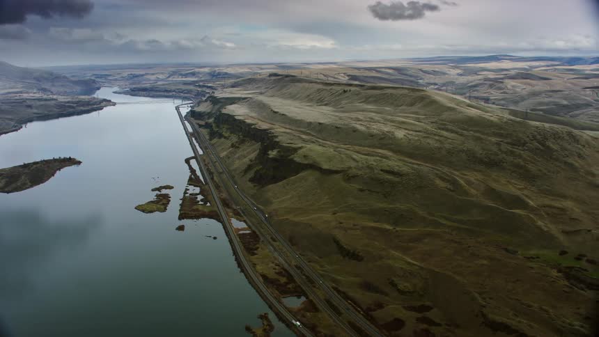 Cars are driving on the coast of the water