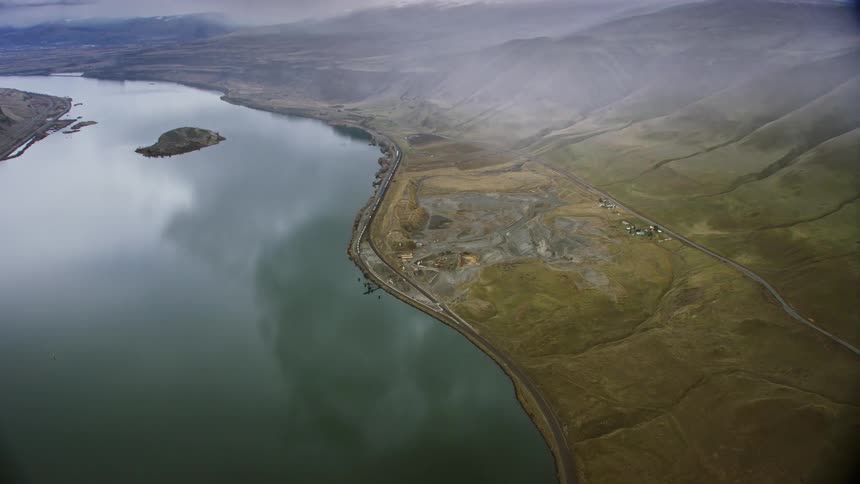 A birds eye view of a vast area encompassing both water and land
