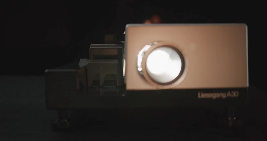 Close up view of a projector in a room is displayed