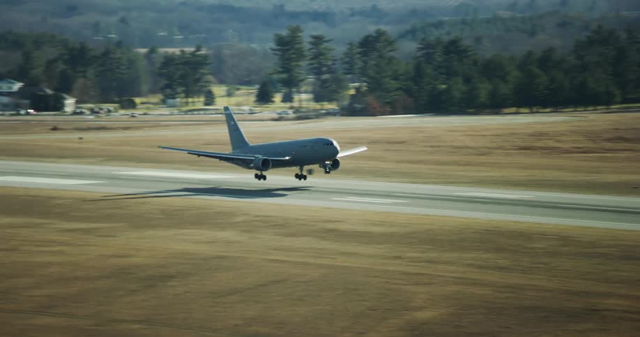 A commercial airplane lands in a runway