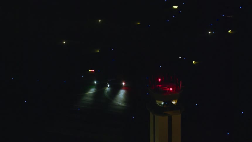 Aerial view of a city during the night time is displayed