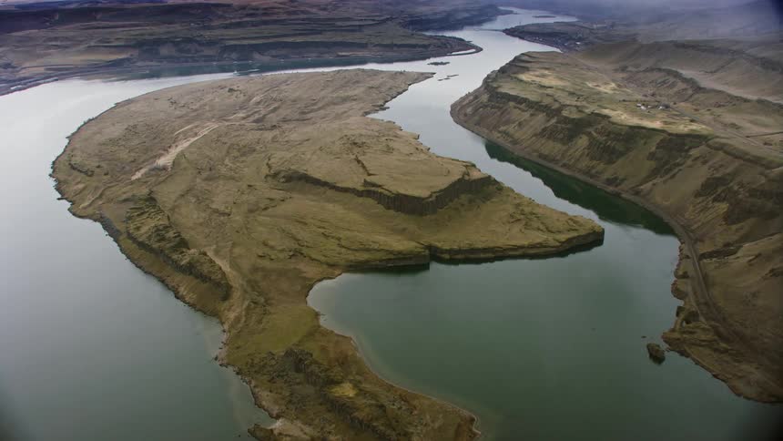 Aerial view of a river near land is displayed