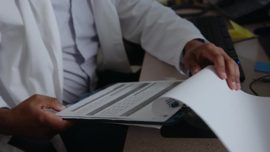 A young man is working inside of a clinic in the day time