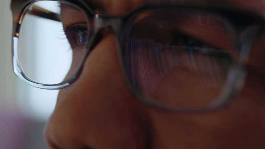 Close up view of a man wearing glasses