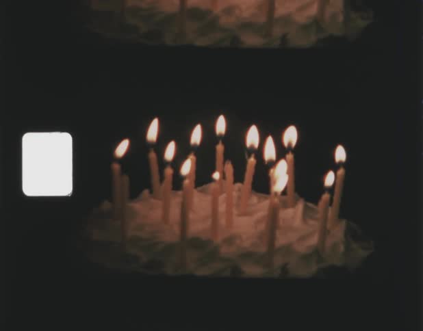 A view of a cake with candles on it