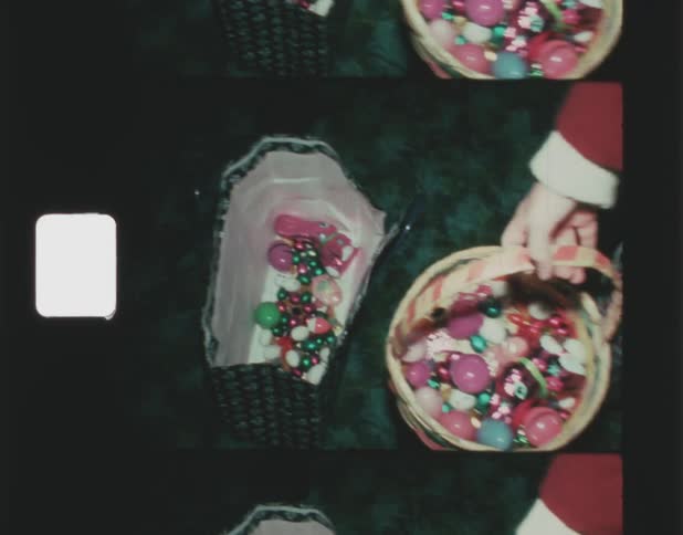 A bag full of easter candy and eggs as a person walks over with a basket full of candy and eggs