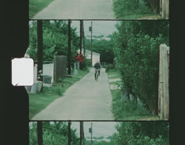 A person is riding their bike down the alley