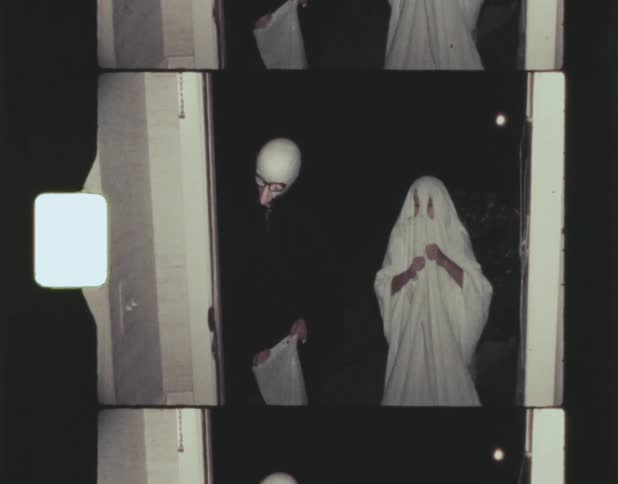 A man gives candy to trick or treaters on halloween