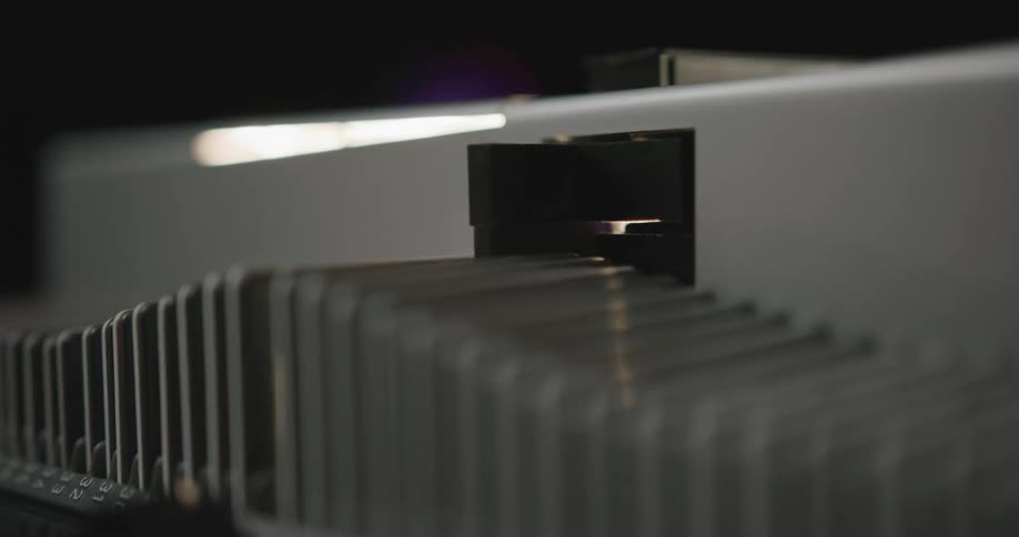 A device is in motion manipulating an object to create an arranged or organized form