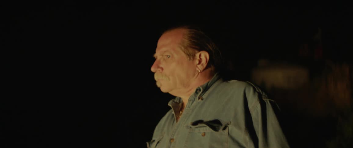 The man looks around in the dark